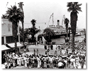Crowd welcoming visitors from steamer upon arrival in Avalon, c. 1941