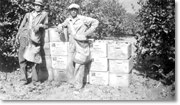 Citrus pickers in front of North Whittier Heights Citrus Association crates, c. 1930s